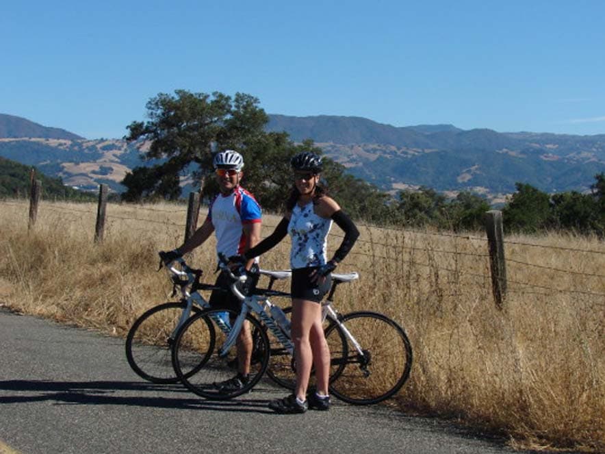 Image of two people standing near bikes from Getaway Adventures