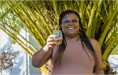 Ginger Harper raising a glass of wine