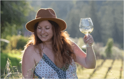 Lauren Monitz raising a glass of wine