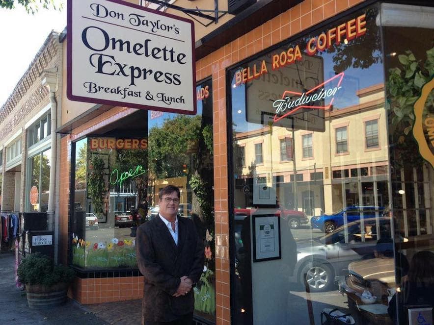 Don Taylor in front of his Santa rosa restaurant, Omelette Express