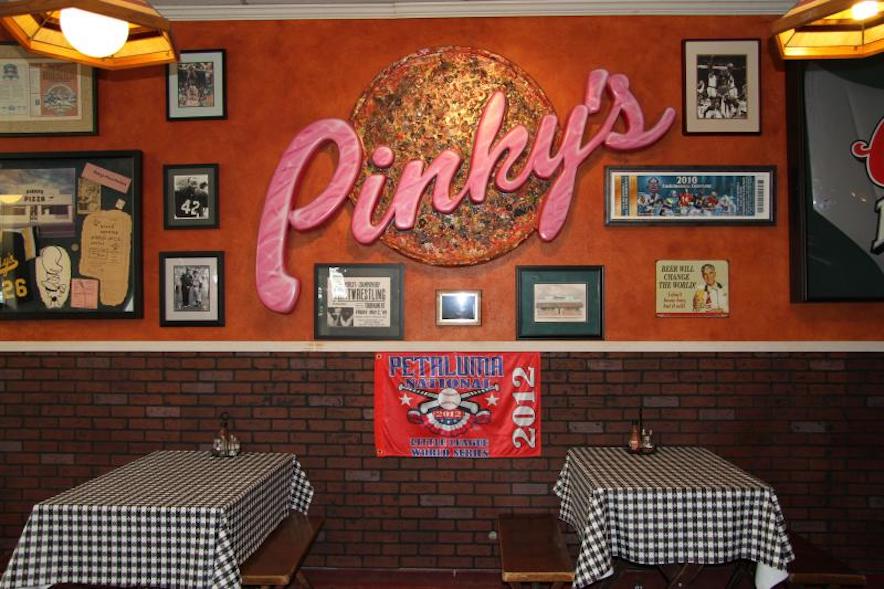 Neon-lit interior of Pinky's Pizza in Petaluma 