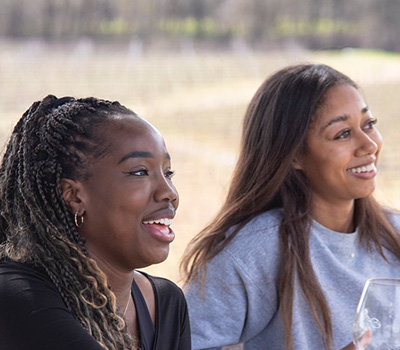 Two women smiling and laughing