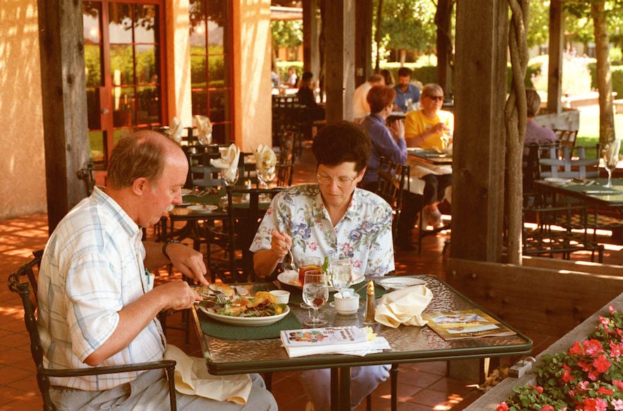 Bill and Cindy Price of San Jose enjoy lunch on the patio at John Ash & Co. restaurant at River Rd and hwy 101 north of Santa Rosa in 1998. (Scott Manchester)