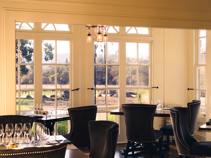 Chairs and wine glasses in an elegant room at Chateau St. Jean in Sonoma County