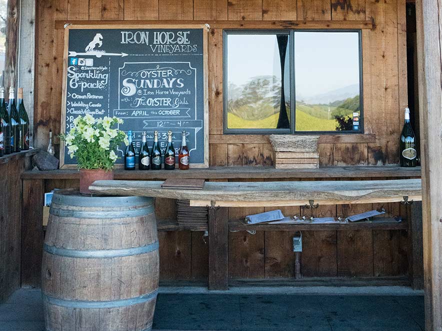 A table made out of a wood plank on top of barrels