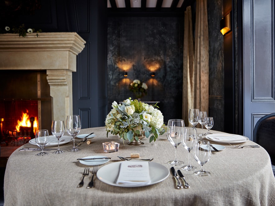 Elegant grey place setting at a dining table in Jordan Winery, Sonoma County