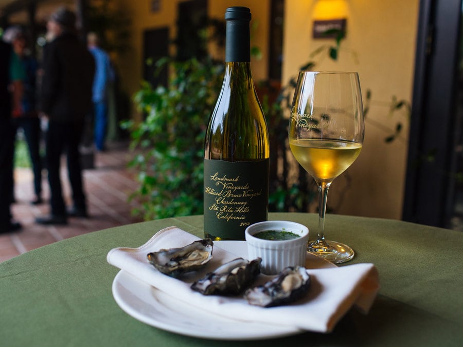 A bottle and glass of Landmark Vineyard's Chardonnay and a few oysters ready to be enjoyed in Sonoma County