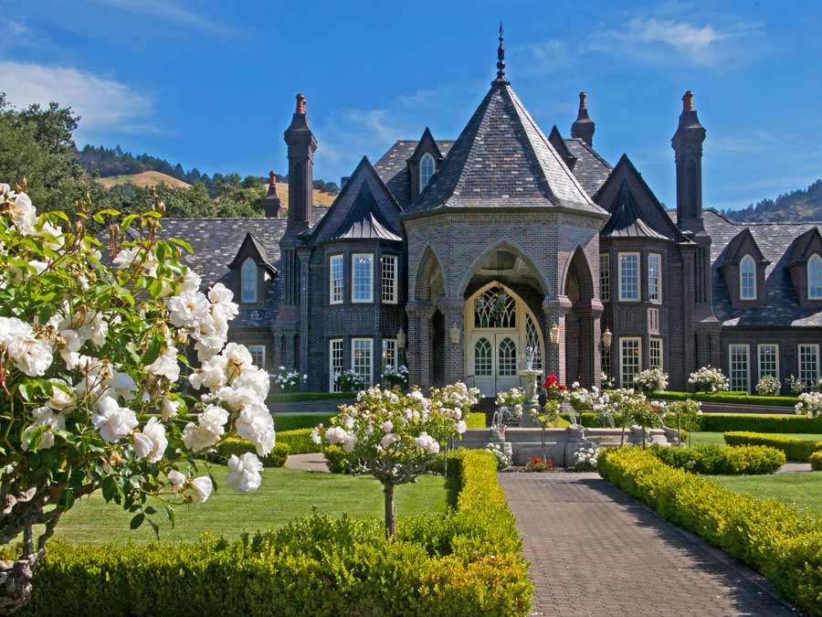 White roses bloom outside of the iconic Ledson Winery & Vineyards, Kenwood