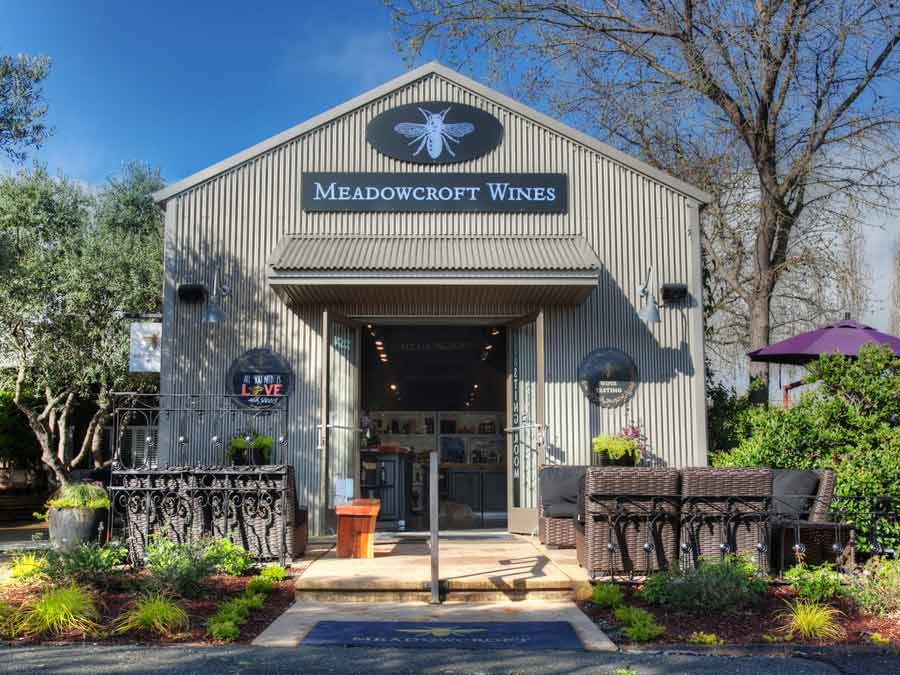 The metal building has tables out front