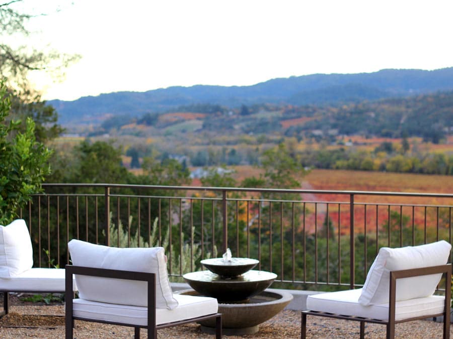 Lounge chairs on the deck facing a beautiful view in Dry Creek Valley