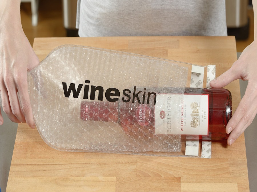 Bubble-wrap lined wine bottle protector called Wine Skin 