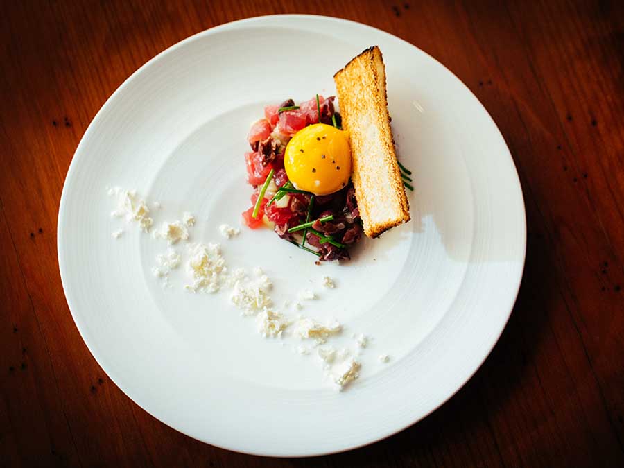 Ahi crudo served on a white plate