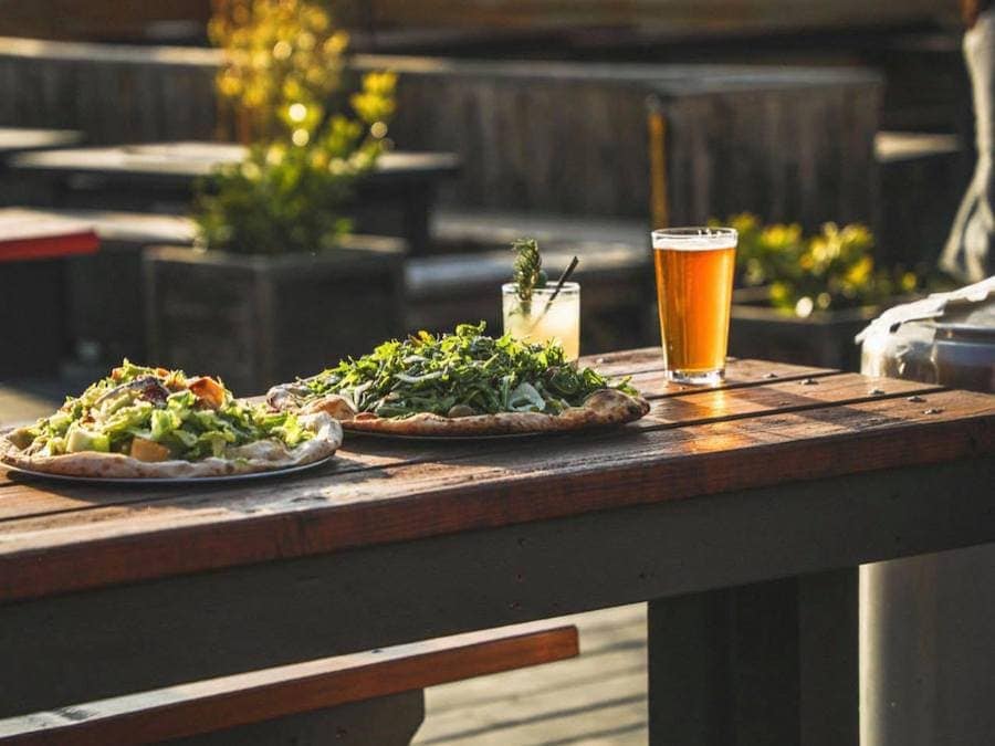 Pizzas and beer on the deck at The Block Petaluma, CA