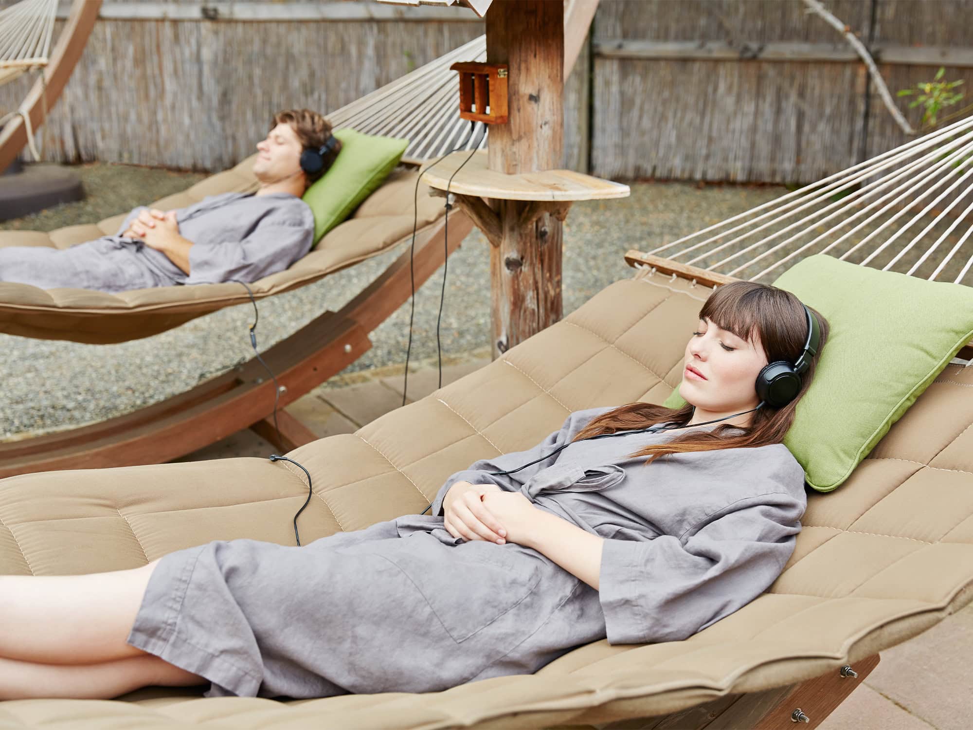 Women lounging on hammocks at Osmosis Day Spa Sanctuary in Freestone, California