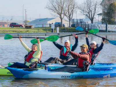people having fun kayaking the river