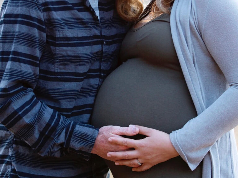 a pregnant couple taking a babymoon vacation in sonoma county