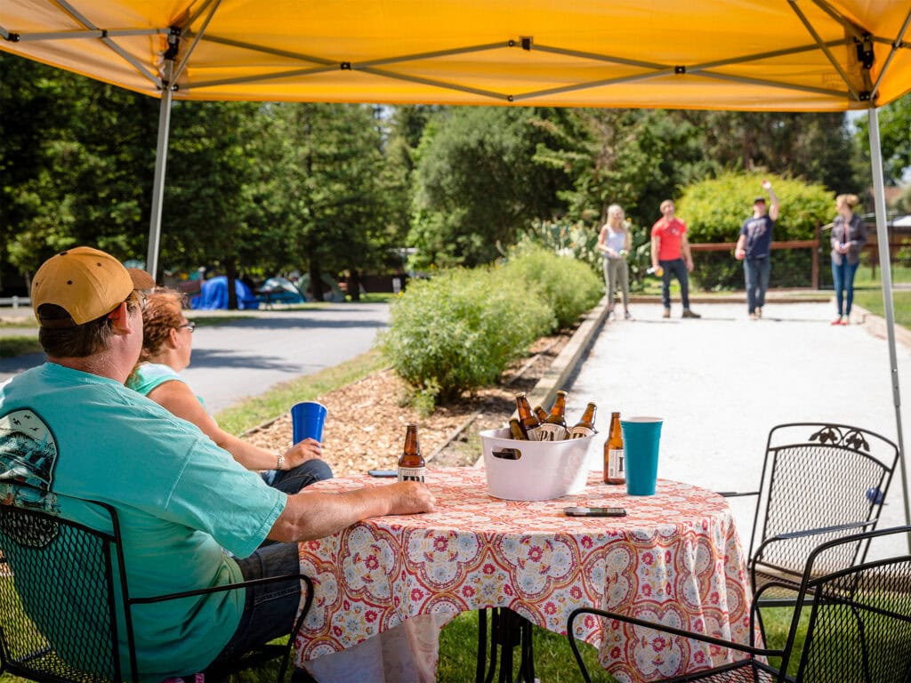 family hanging out playing bocce ball and camping at san francisco north petaluma koa resort in petaluma 