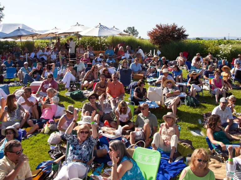 big group of people enjoying live music at rodney strong winery in healdsburg