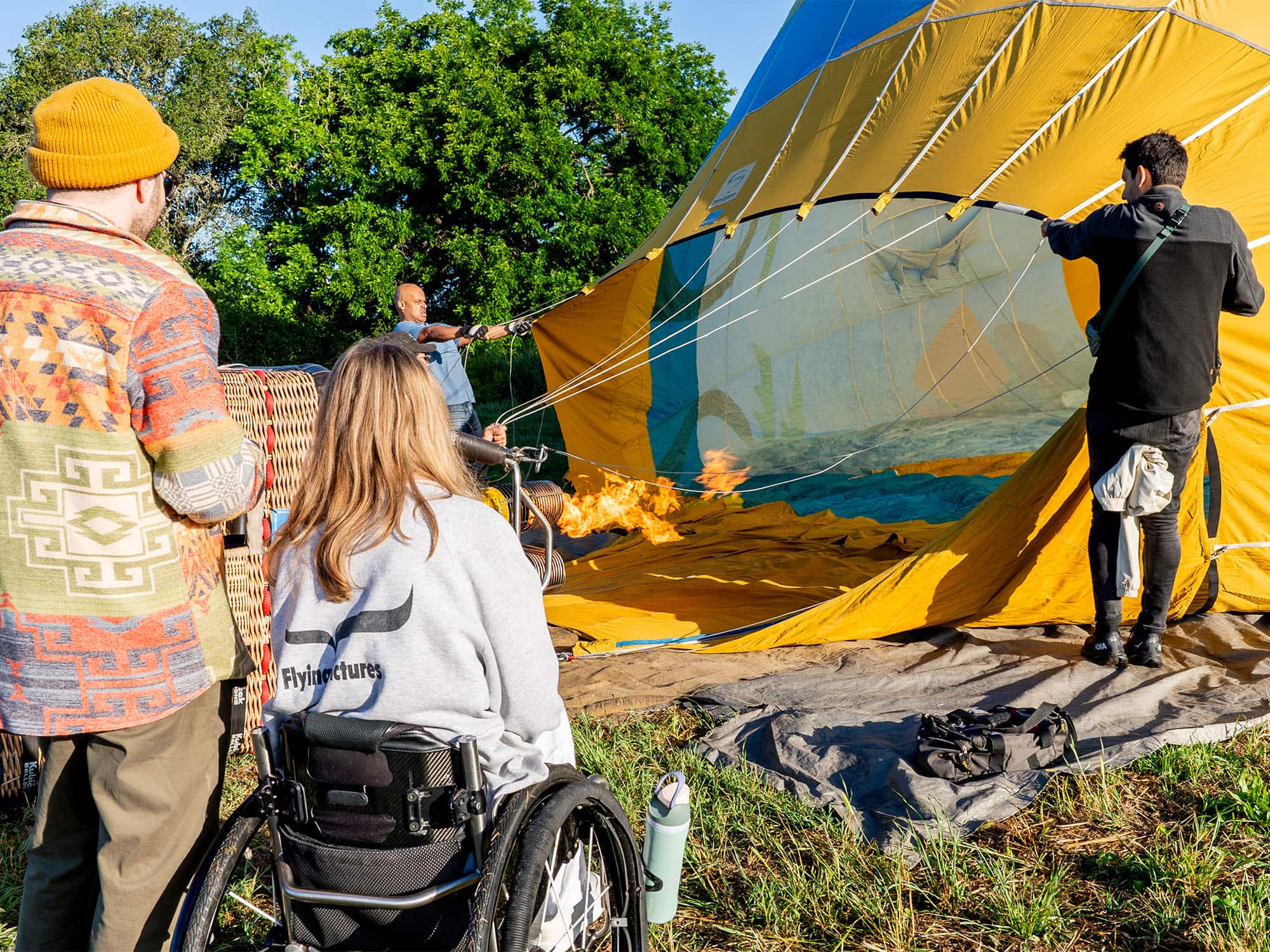 couple watching the hot air balloon fill up before they go on their wheelchair friendly hot air balloon ride