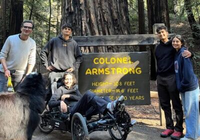 a family visiting armstrong redwoods state park that is wheelchair accessible