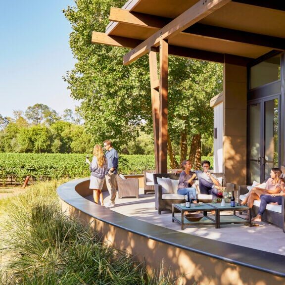 Group of people enjoying wine in the vineyards of Sonoma County